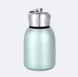 A green stainless steel thermos with a silver cap.