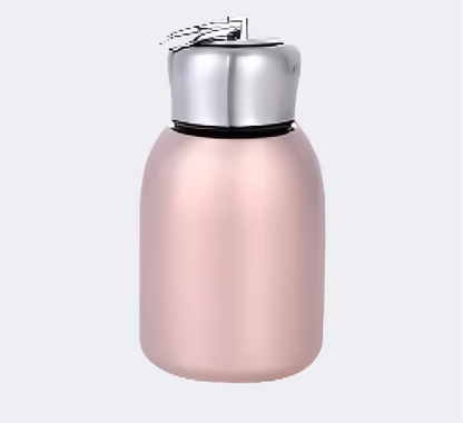 A sleek pink stainless steel thermos with a compact design.