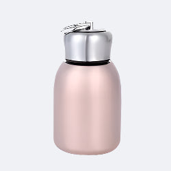 A pink stainless steel thermos with a silver cap.