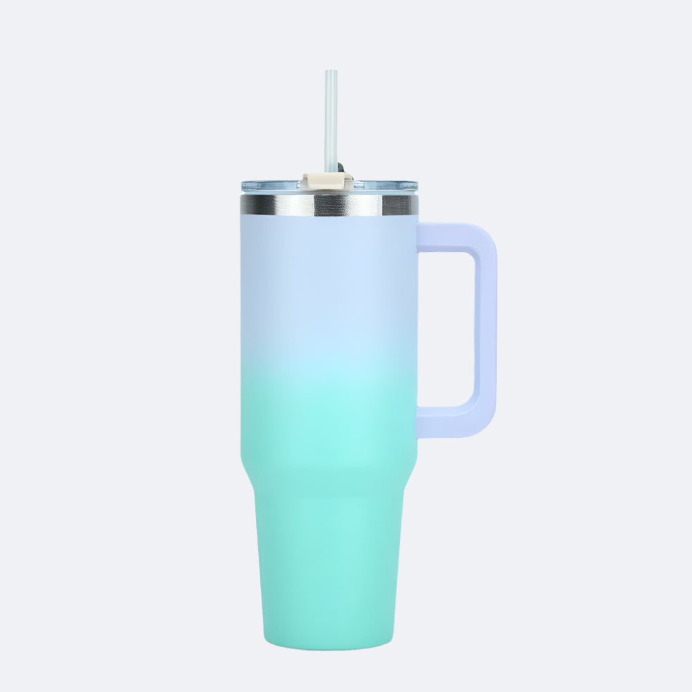 A green-blue stainless steel tumbler with a straw lid and handle, displayed against a white background.