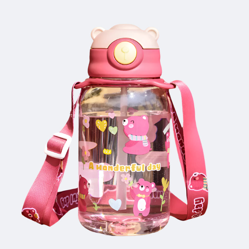 A pink water bottle with a cartoon character design, featuring a soft straw and a carry strap